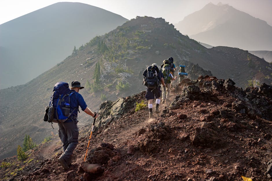 Group of hikers trekking on a rugged mountain trail in Oregon's scenic outdoors